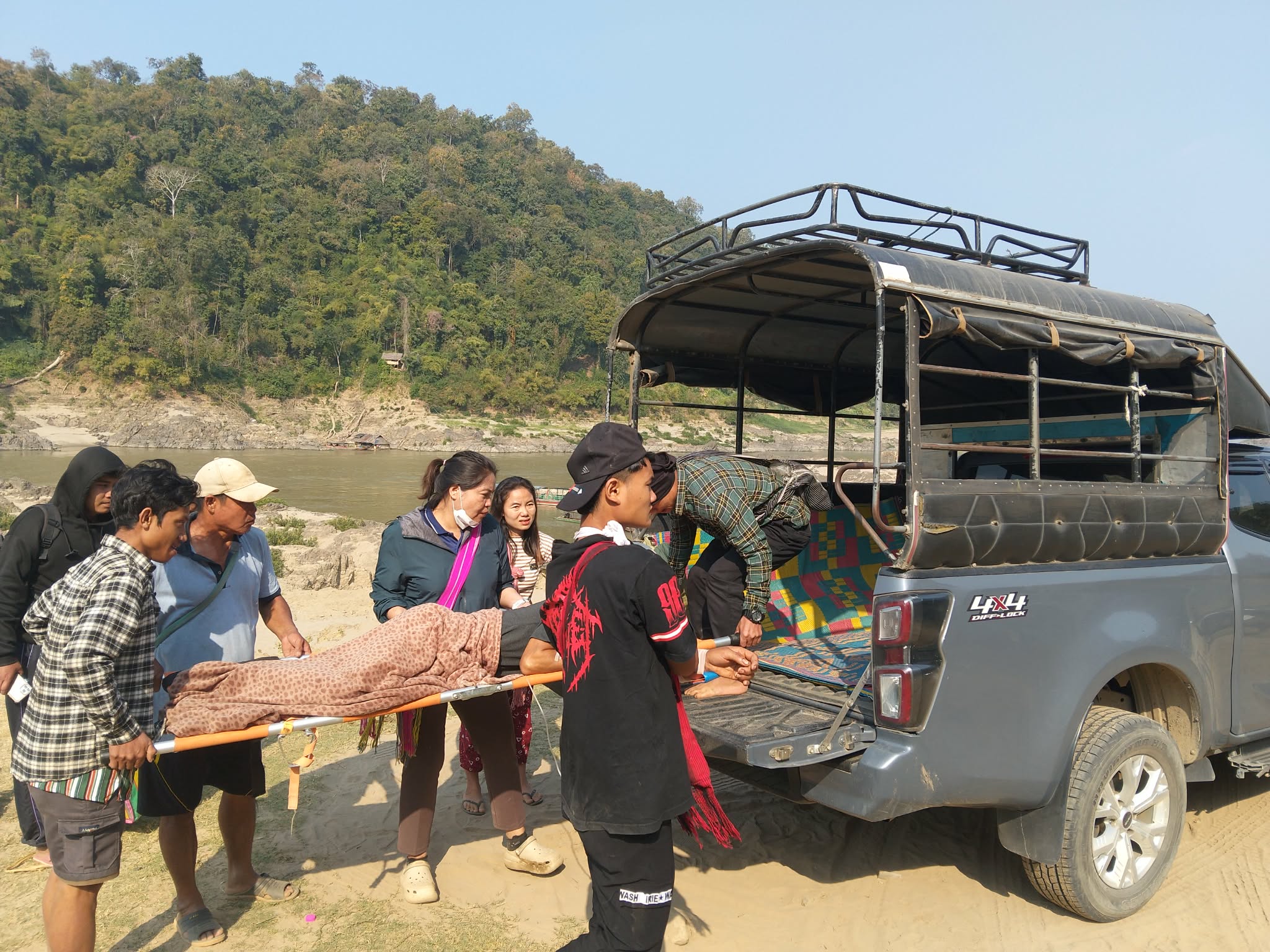 Patient being transported across the border by boat